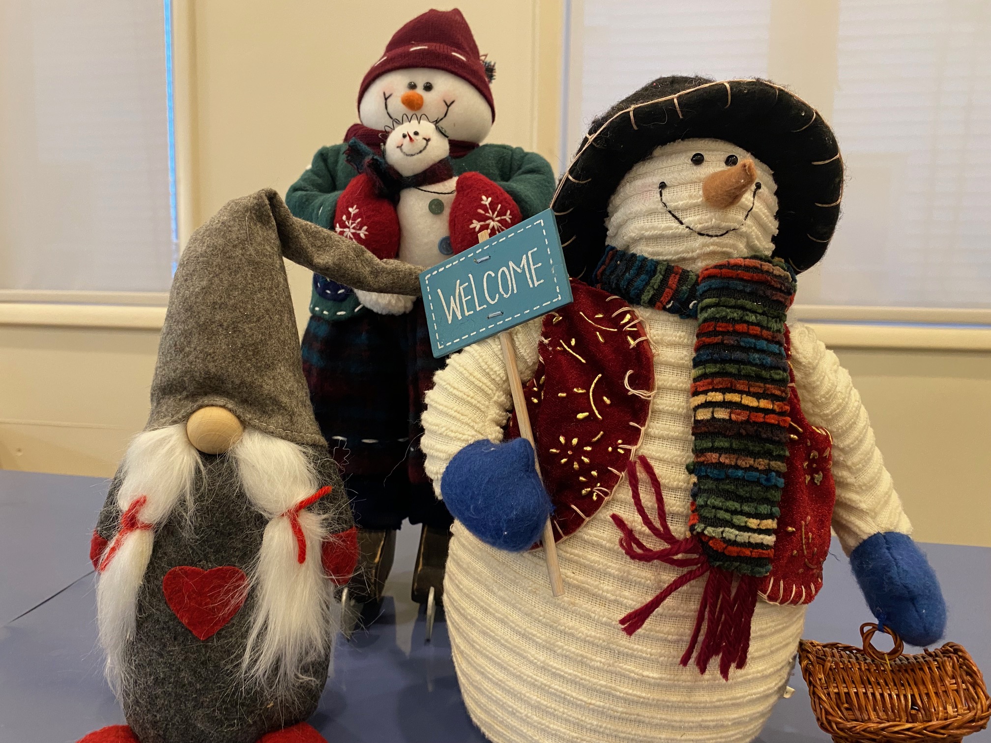 snowmen stuffed animals on shelf
