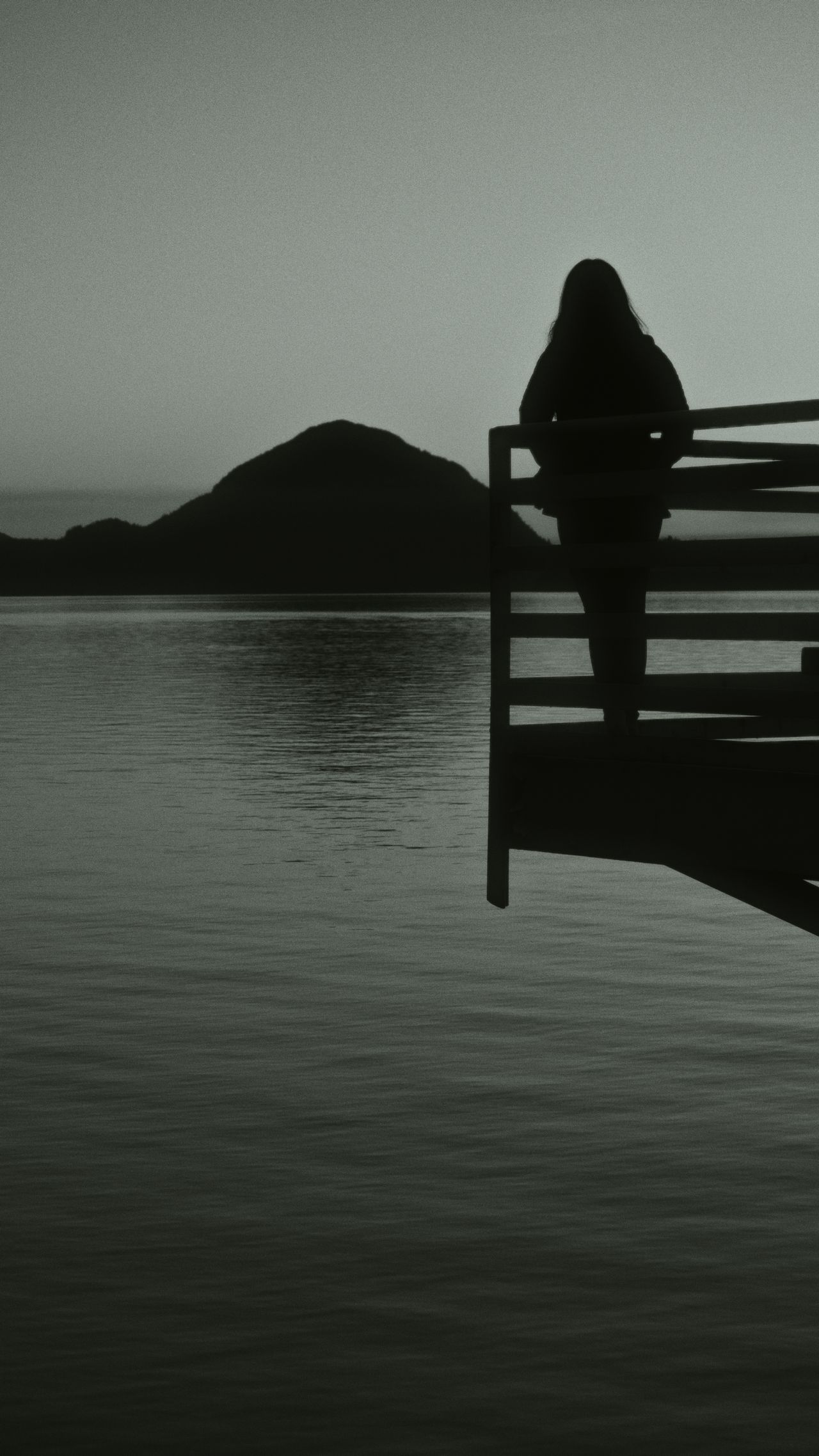woman looking out on water