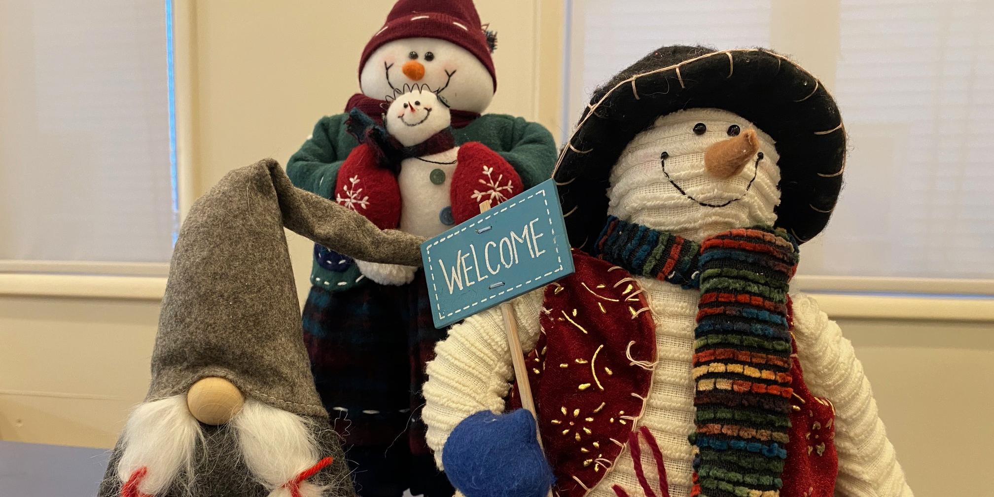snowmen stuffed animals on shelf