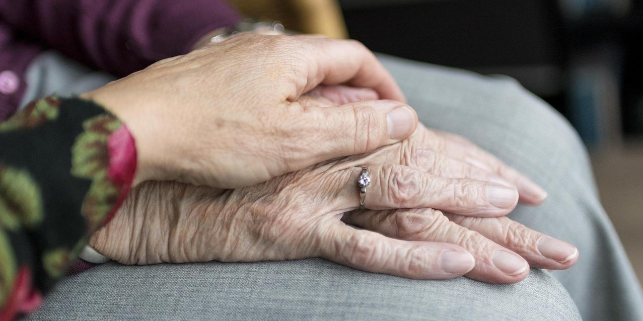 older couple holding hands